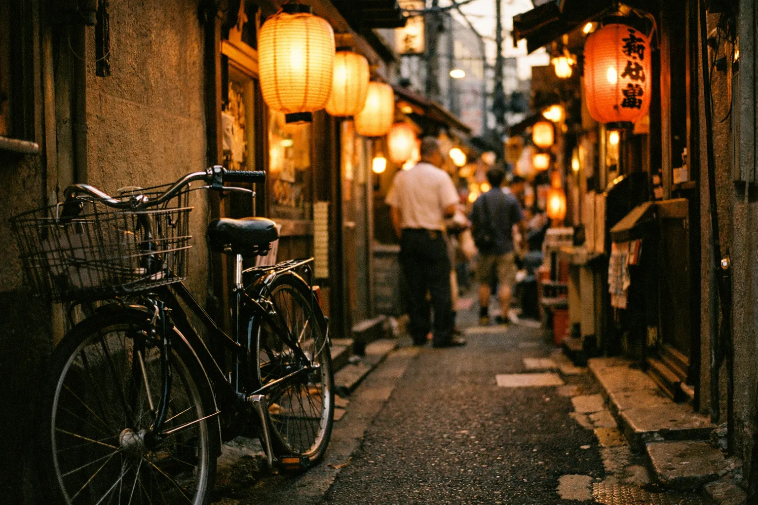 Tokyo backstreet at golden hour, glowing paper lanterns, a parked bicycle in a narrow alley, warm bustling atmosphere, candid documentary street photography, 35mm film look